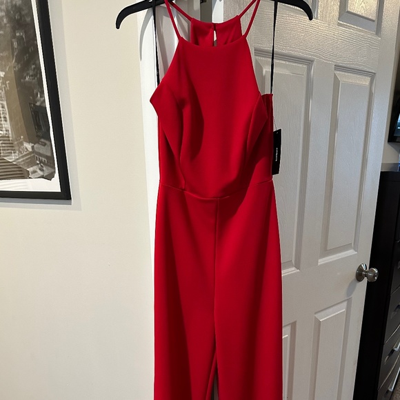 Red sleeveless high neck  jumpsuit - Picture 1 of 4